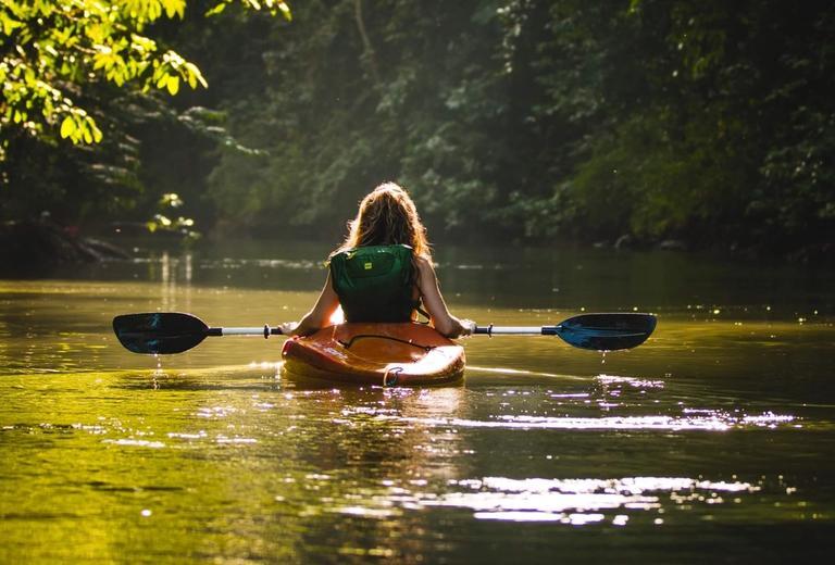 girl in a kayak in the wetlands